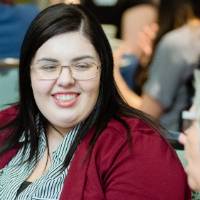 Guest smiling at Scholarship Dinner 2019